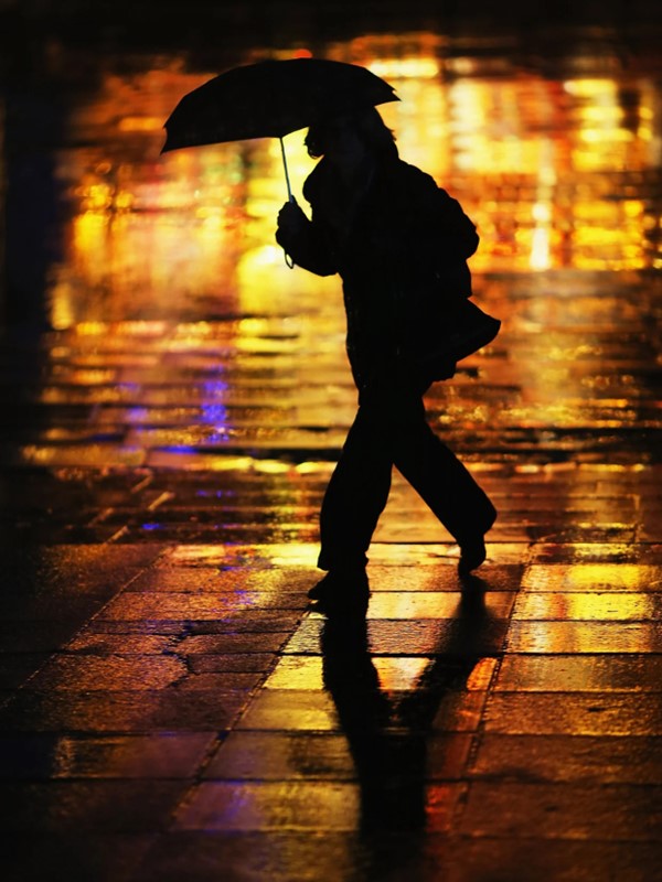Person with umbrella in the London rain